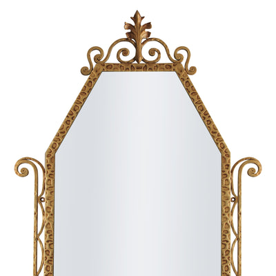 A close up of a classical hand forged mirror with textured scrolls painted in an antique gold finish