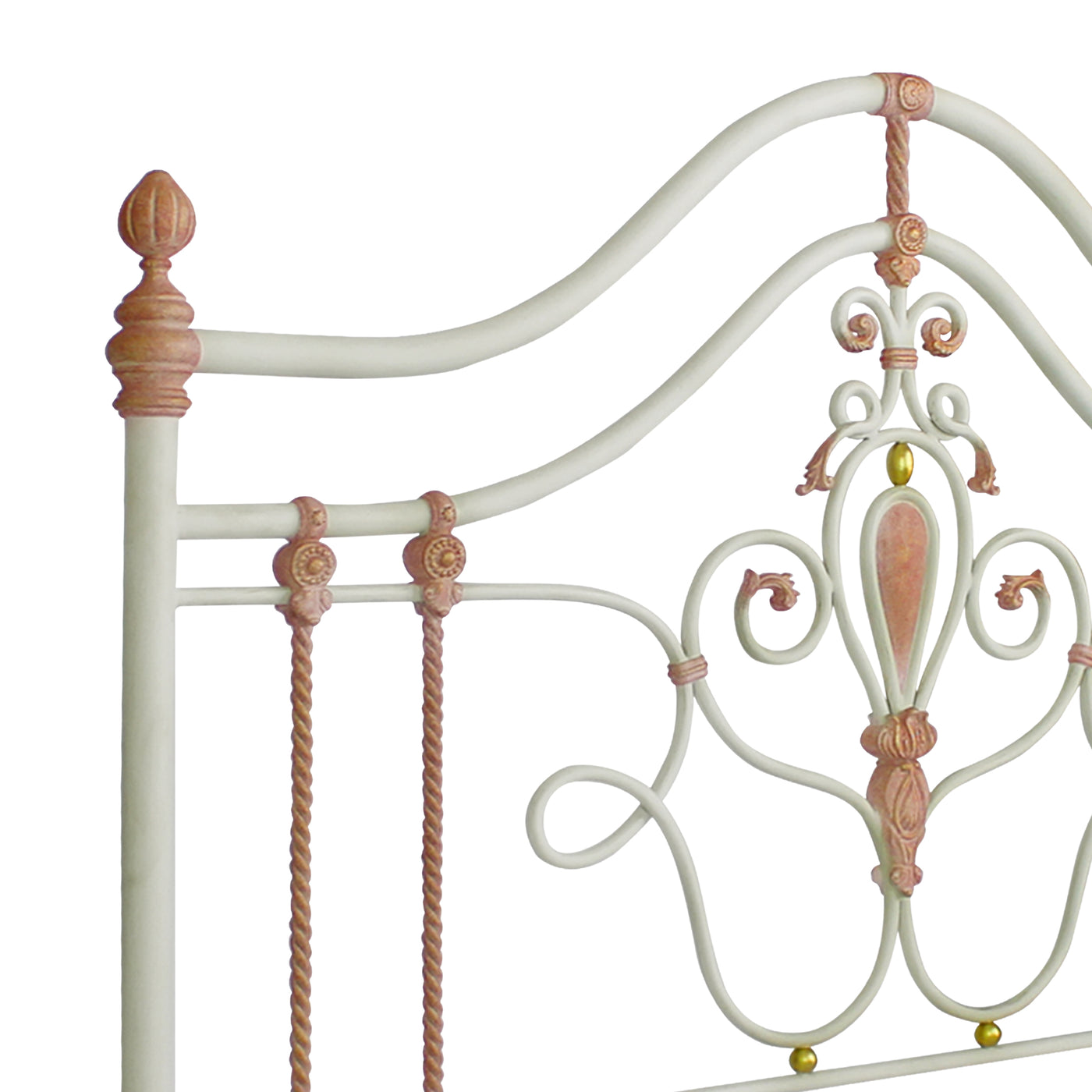 Close up of a  a metal headboard for a girls single bed with scrolls, leaves and classical motifs painted in white, pink and hints of gold