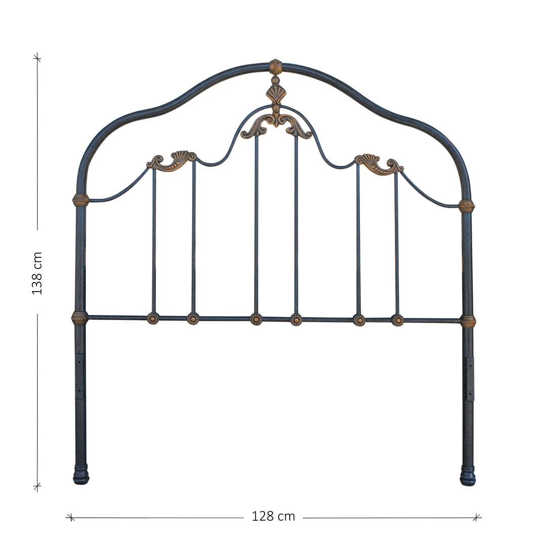 A classical wrought iron headboard with shell motifs inspired by the ocean