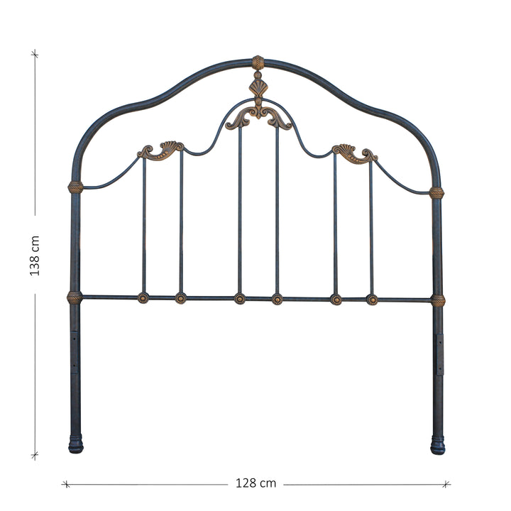 A classical wrought iron headboard with shell motifs inspired by the ocean