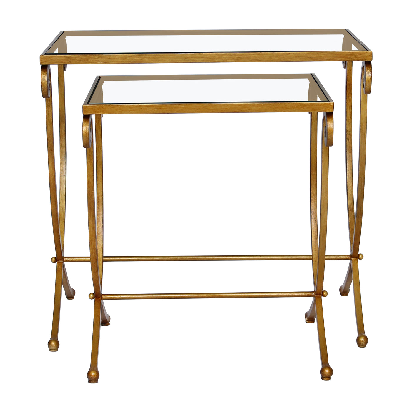 A set of two wrought iron nesting tables with long scrolled legs painted in antique gold and topped with glass