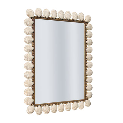 A contemporary rectangular mirror with metal seashells along its border painted in an antique rustic finish