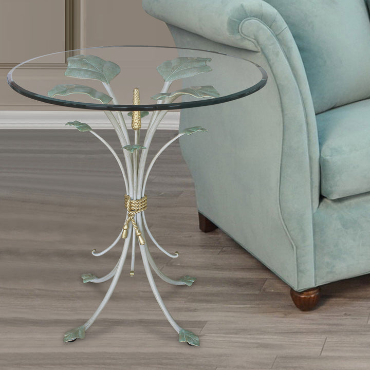 Luxurious side table with base resembling branches inspired by nature; topped with clear glass
