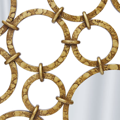 Close up shot of a unique mirror made up of adjacent rings in an antique gold finish