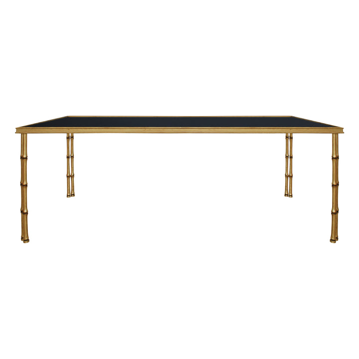 Front view of bamboo themed coffee table with black glass top in antique gold color
