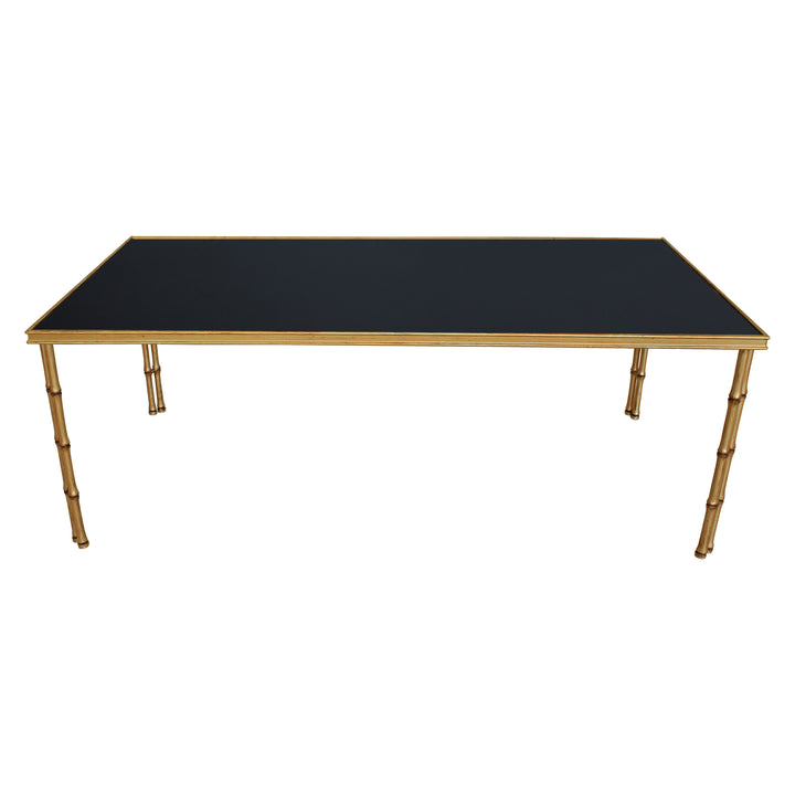 Bamboo themed center table with black glass top and antique gold finish