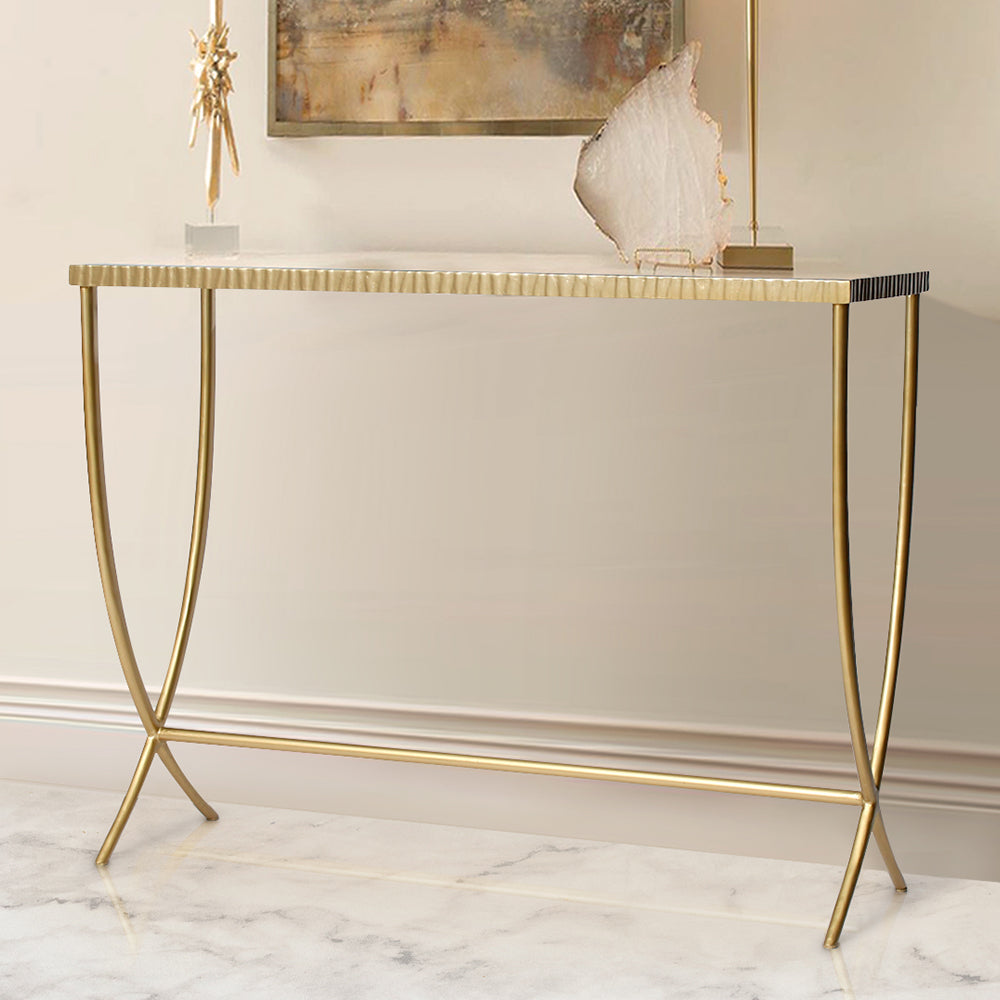 Simple steel console table with a textured upper frame and elegant steel legs, topped with clear glass