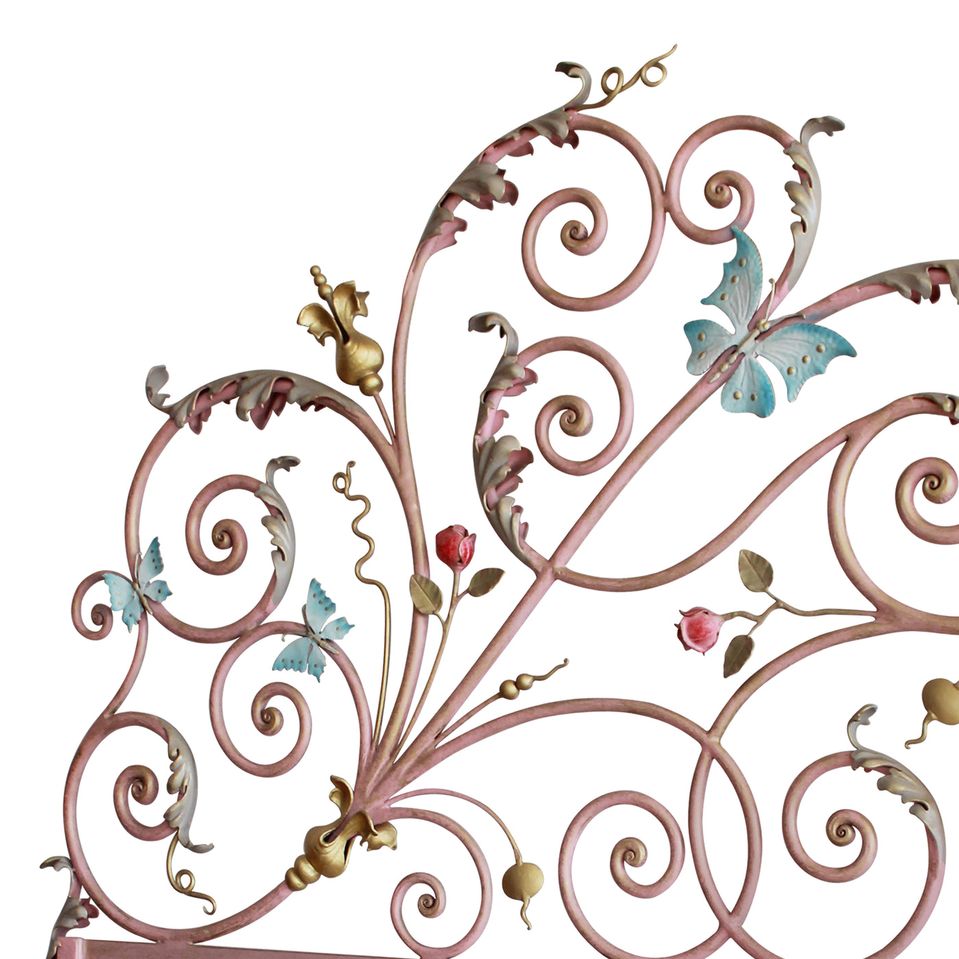 Close up of a unique wrought iron headboard for a girly bed with pink scrolls, blue butterflies and red roses
