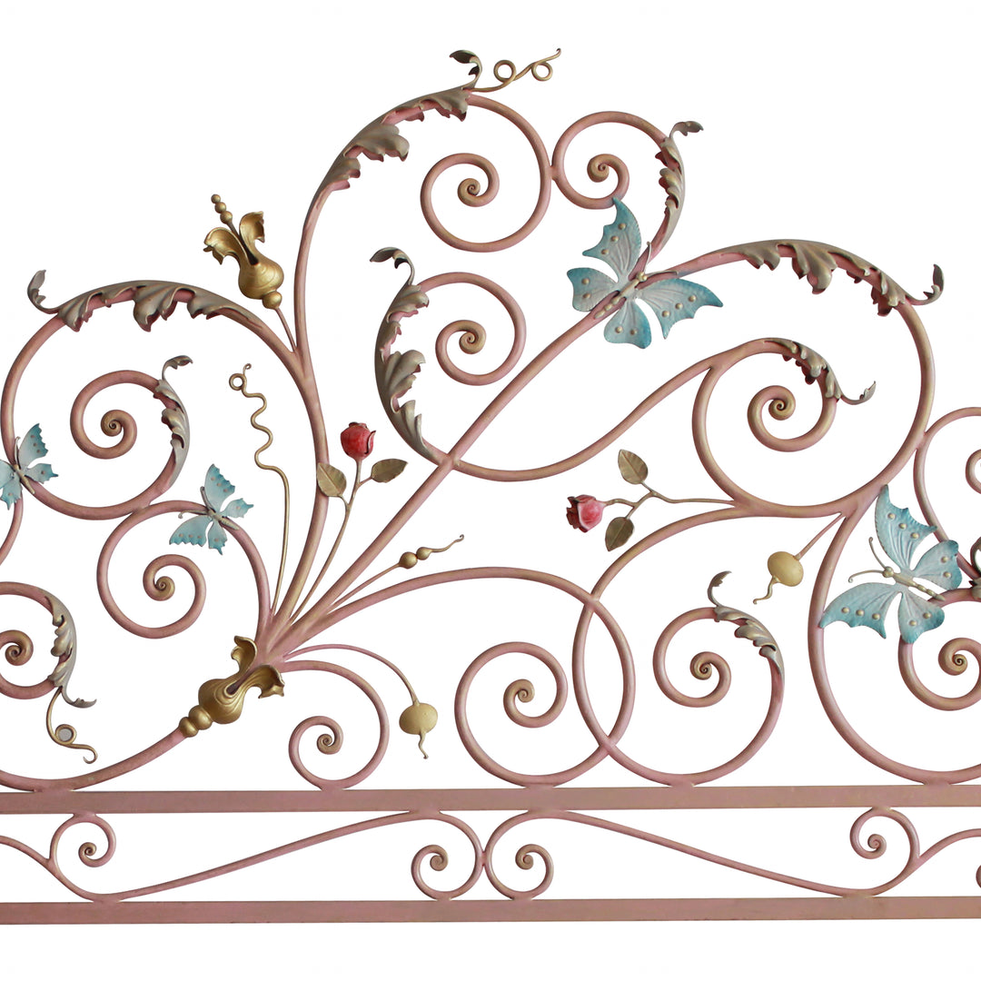 Headboard for a single girly bed with pink scrolls, blue butterflies and red roses