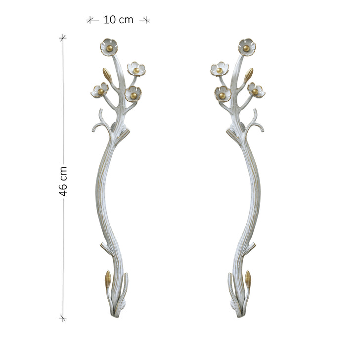 Flowers and branches themed steel door pull handles in white; with annotated dimensions