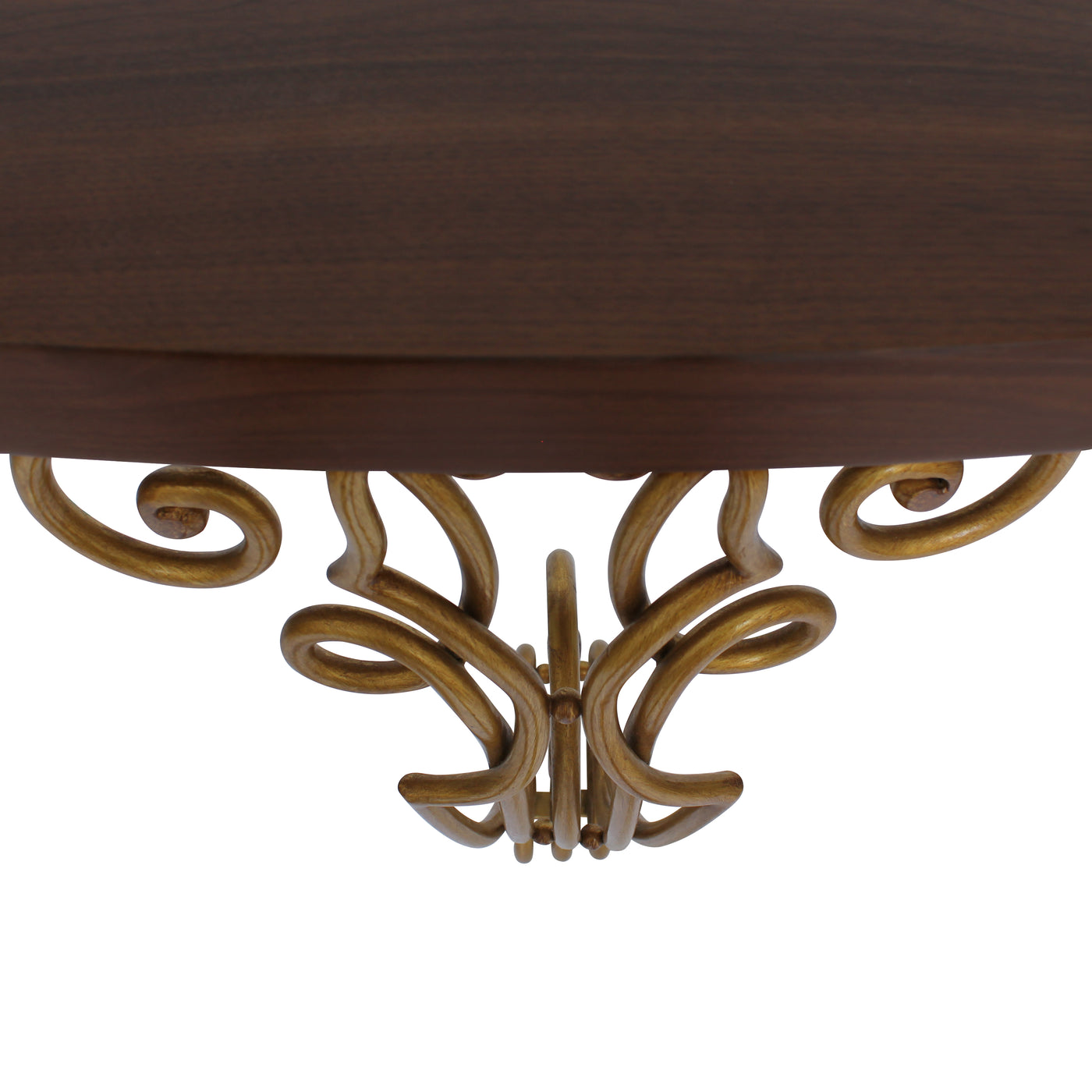 Close up of a bronze colored classical console with a wrought iron base and a dark wooden top